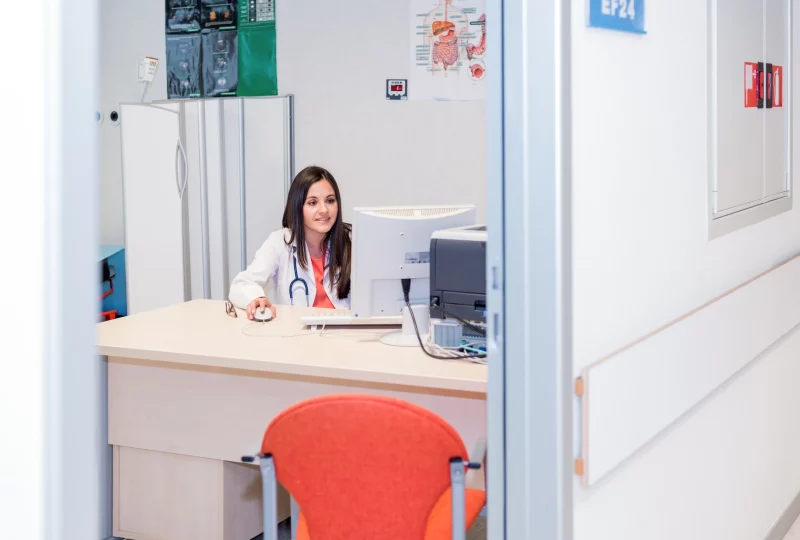 Doctor booking an appointment at a computer at Eastgardens Medical Centre