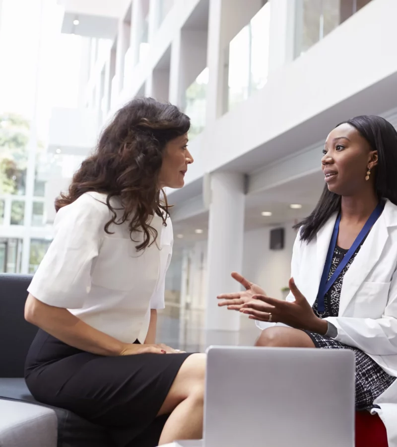 A doctor and patient meeting at the hospital reception